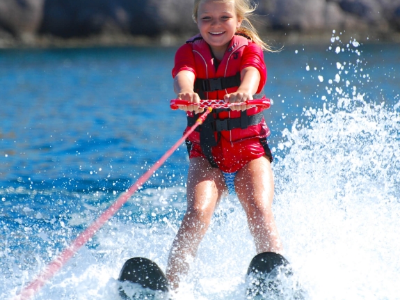 young girl waterskiing