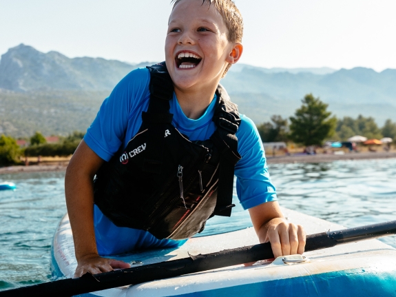 boy on paddle board