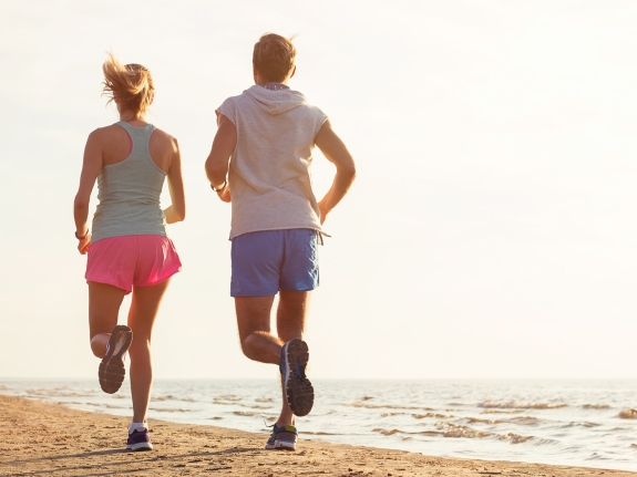 couple running on the beach