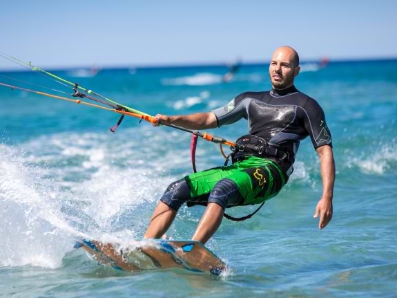 man kitesurfing