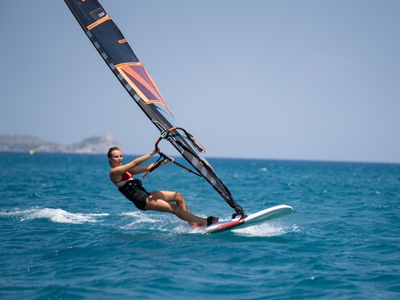 girl windsurfing in greece