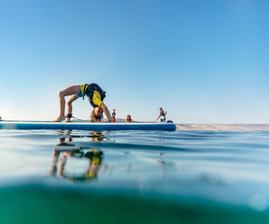 kids on paddle board