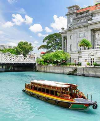 Turistbåd på Singapore River Turistbåd på Singapore River