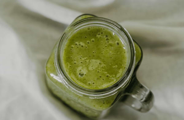 Green smoothie with spinach and avocado