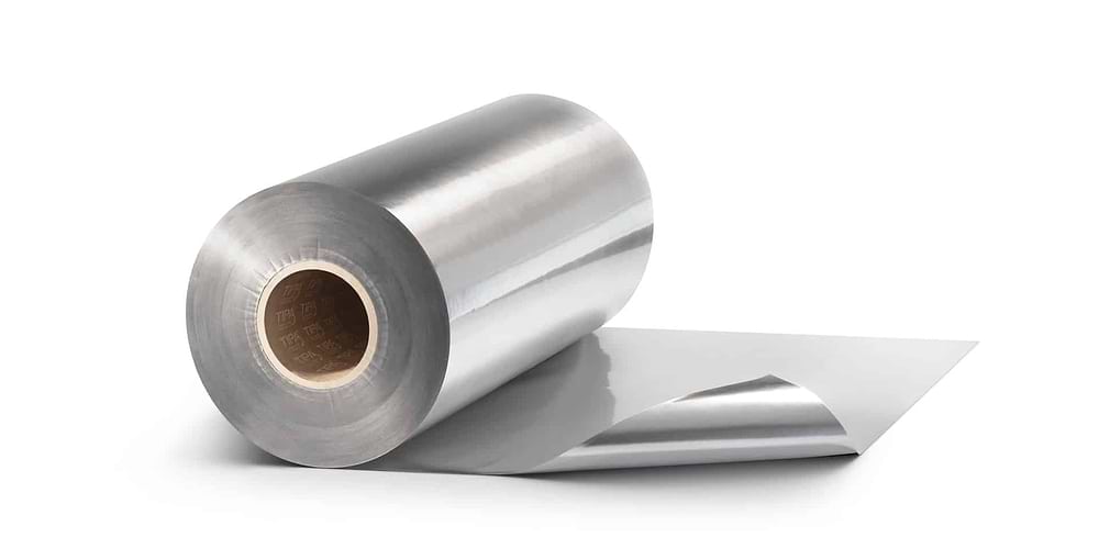a roll of silver laminate food packaging film