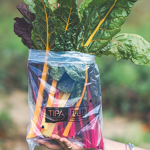 Open bag leafy greens, farm