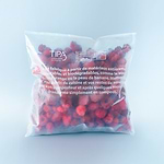 Close-up of frozen mixed berries in eco-friendly packaging
