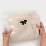 clothing packaging being held
