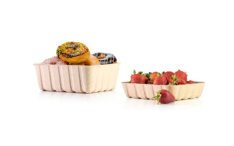donuts and strawberries in a paddy straw tray