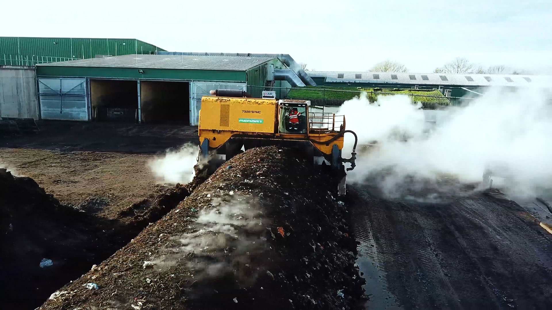 Machine working on compost
