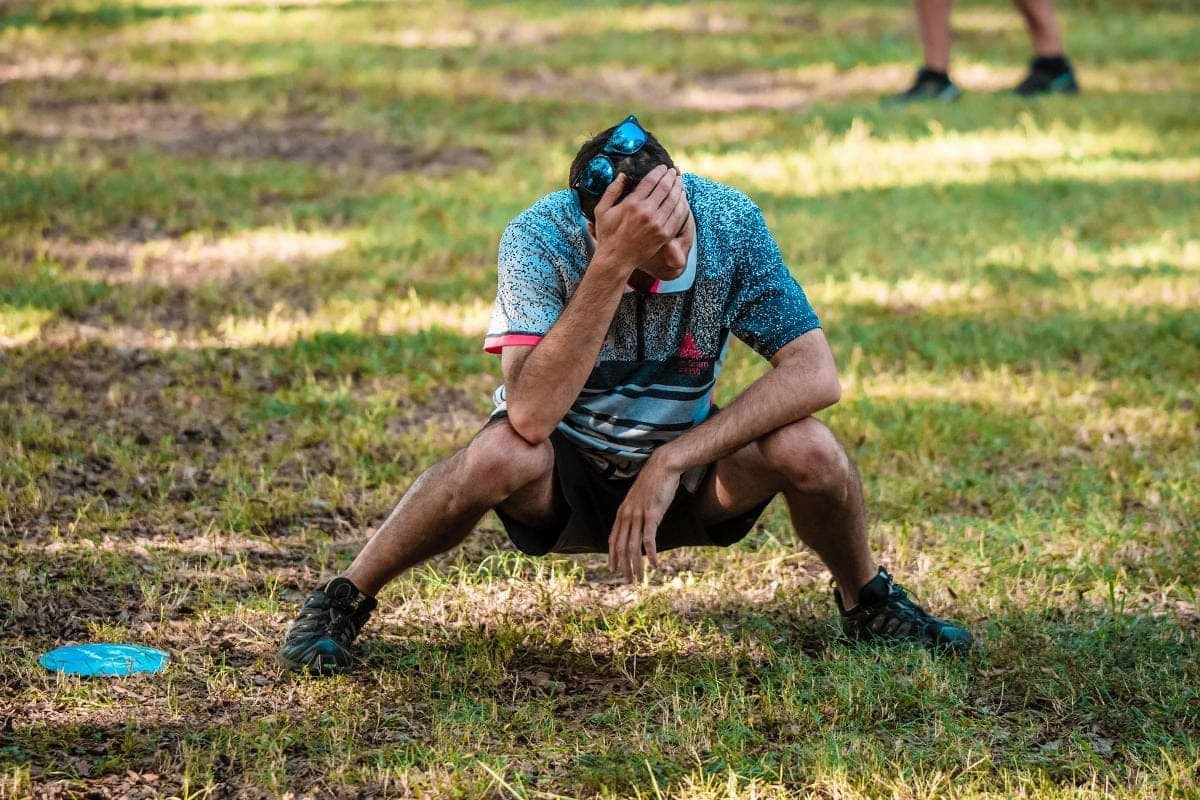 Simon Lizotte showing frustration after a bad disc golf throw