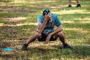 Simon Lizotte showing frustration after a bad disc golf throw