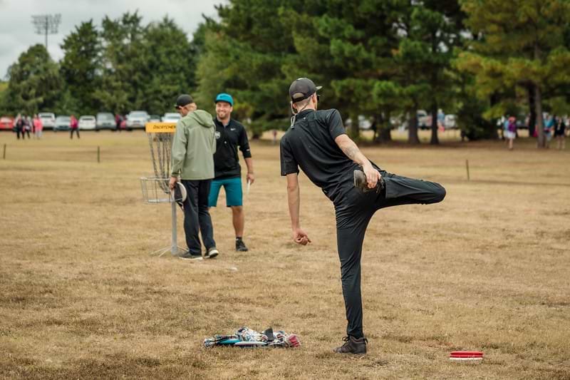 Stretching before and after a round of disc golf helps prevent injuries
