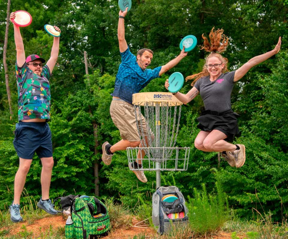 Innova Employees jump for joy to show off the best disc golf apparel for summer