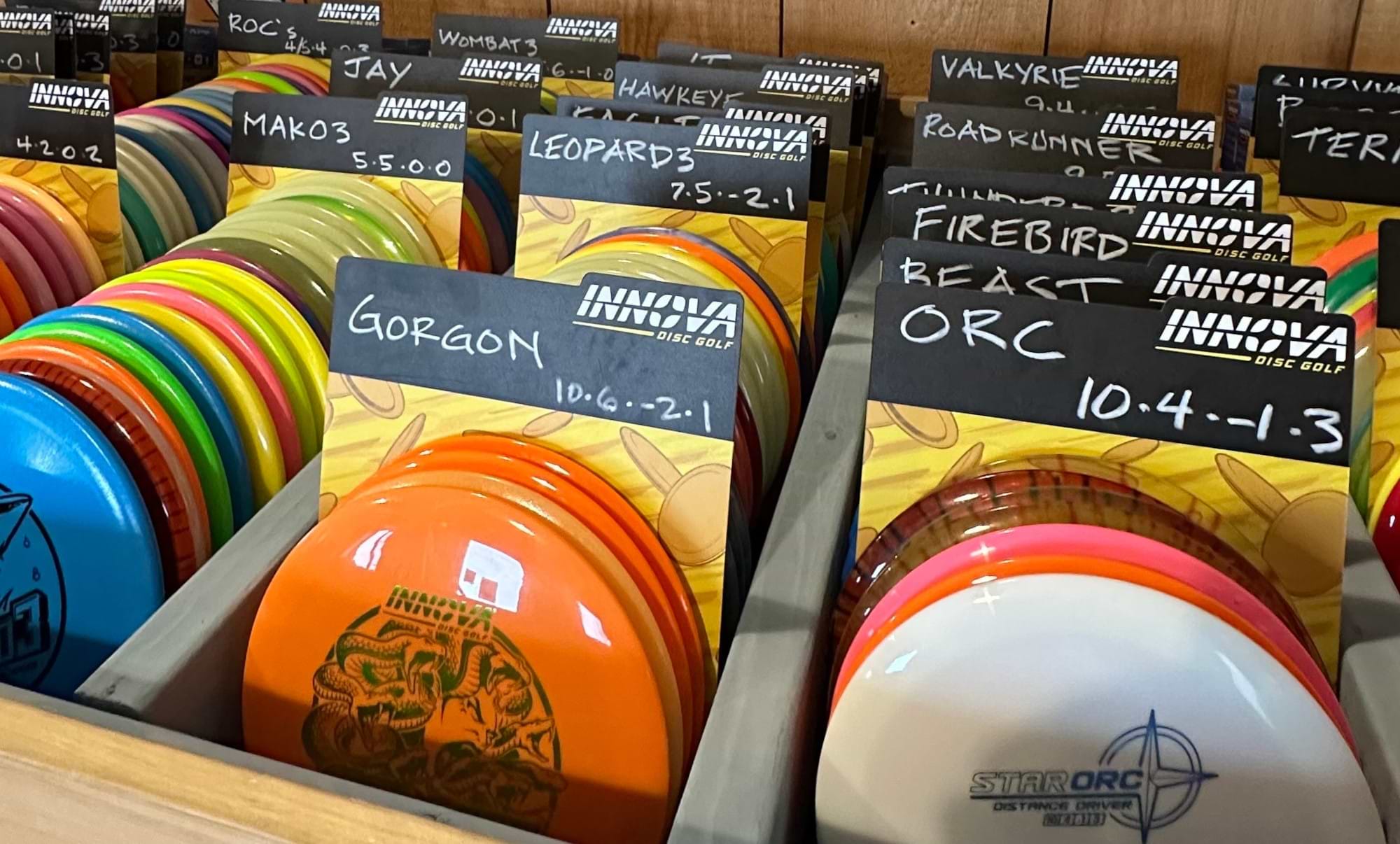 Rack of disc golf discs at a retail store