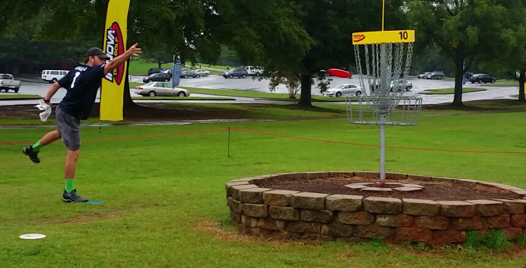 Augusta team member putting on hole 10