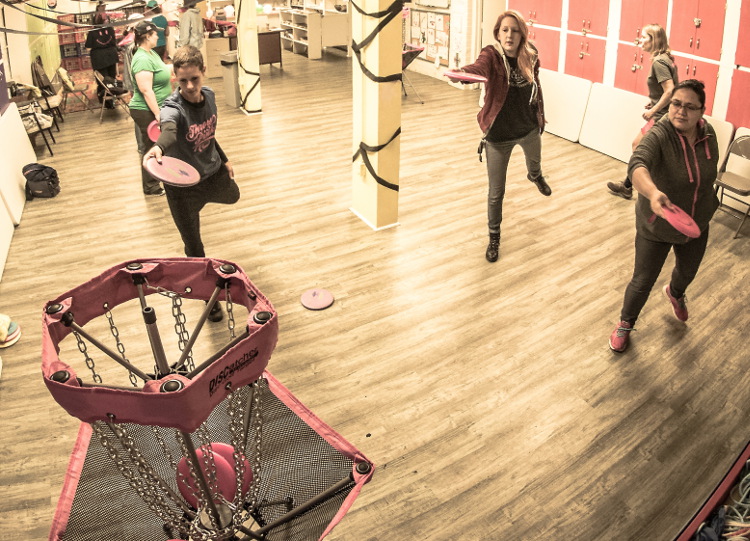 The Throw Pink putting clinic happened inside because of the rain.