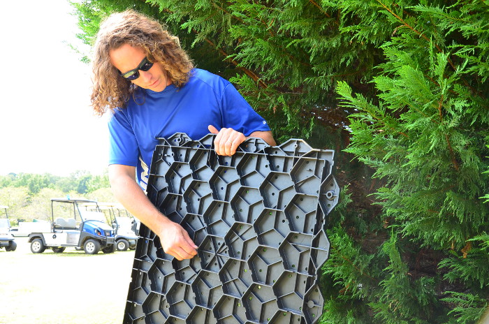 Levi Bennett explains water channeling feature of the Turf Tee's sub structure.