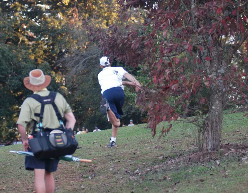 Disc Golfer and Spectator