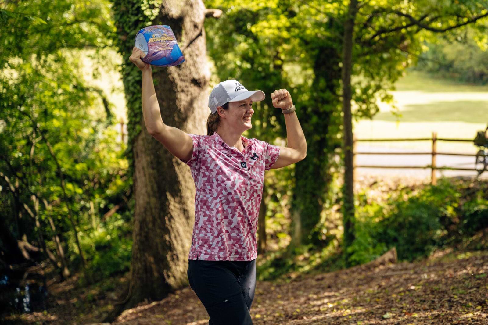 Holyn Handley raises her trophy after winning the 2026 Throw Pink championship at Winthrop.