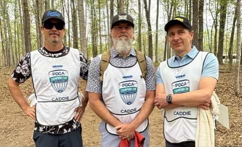 Justin Scoggins, Jonathan Poole, and Mr. Lehtomaki: champion caddies.