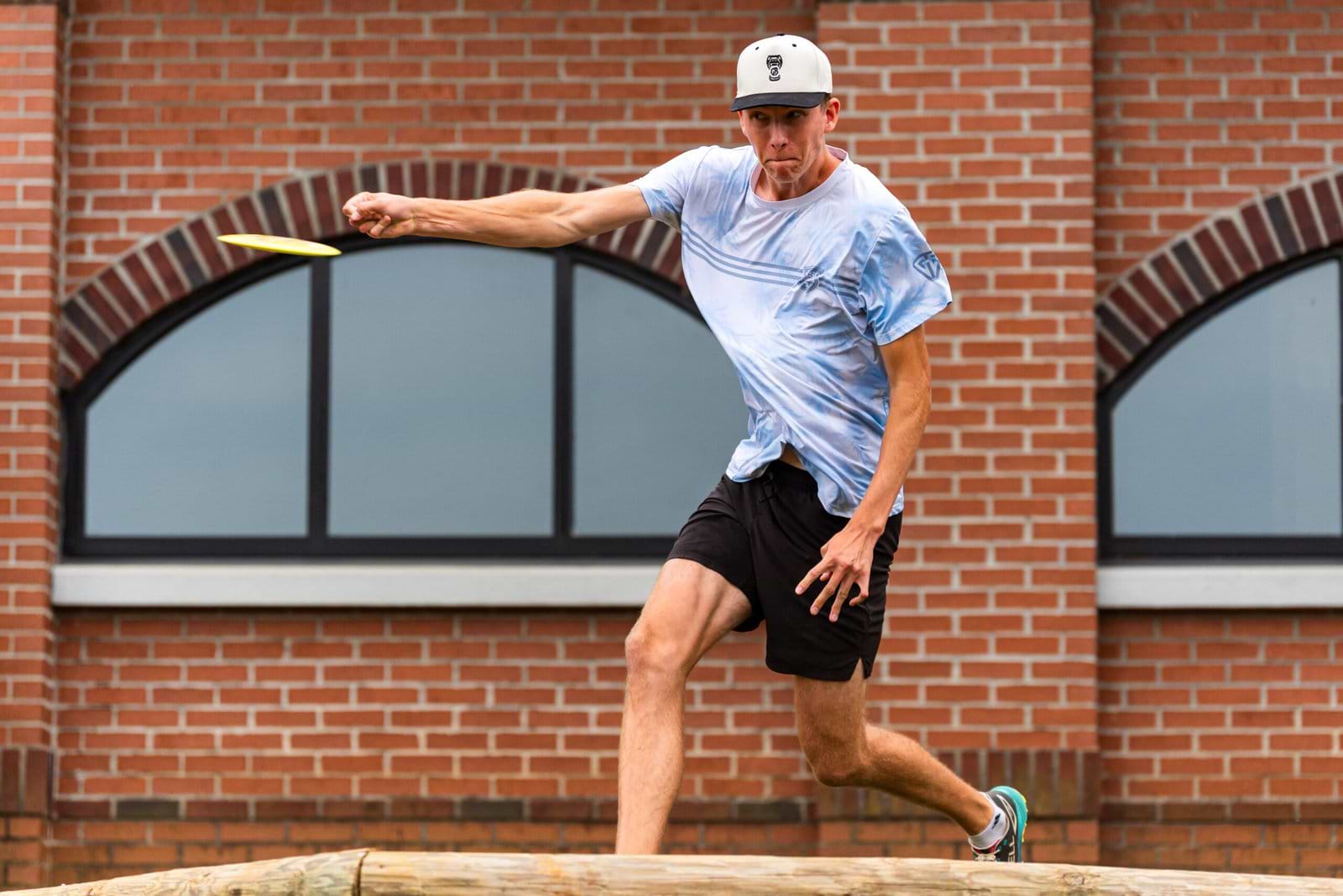 Gannon Buhr releases a forehand throw in front of the brick arches at Winthrop during Friday’s second round.