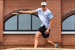 Gannon Buhr releases a forehand throw in front of the brick arches at Winthrop during Friday’s second round.