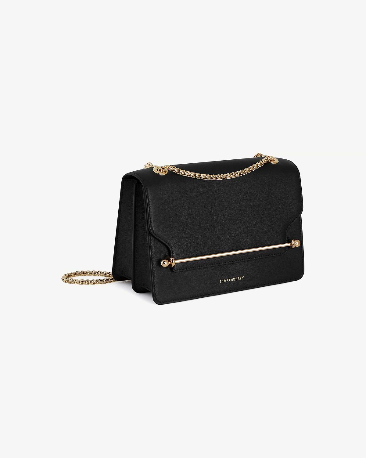 Black east-west leather bag with gold chain strap, gold bar detailing, and Strathberry logo.