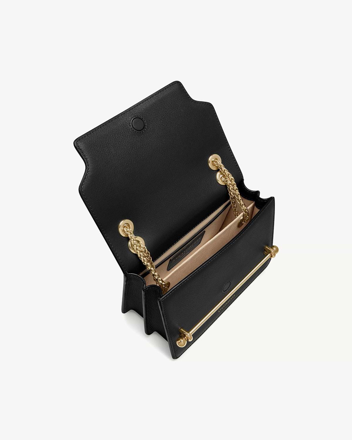 Black East/West mini bag open, showing gold chain strap and interior card slot.