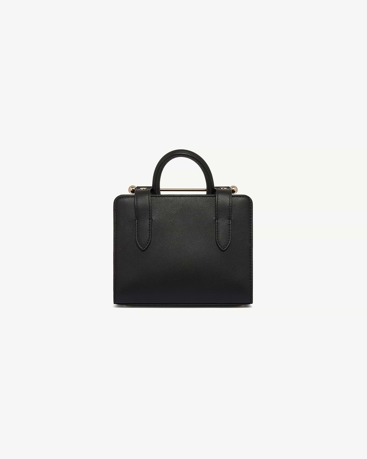 Black leather nano tote with top handle and gold-tone bar detail.