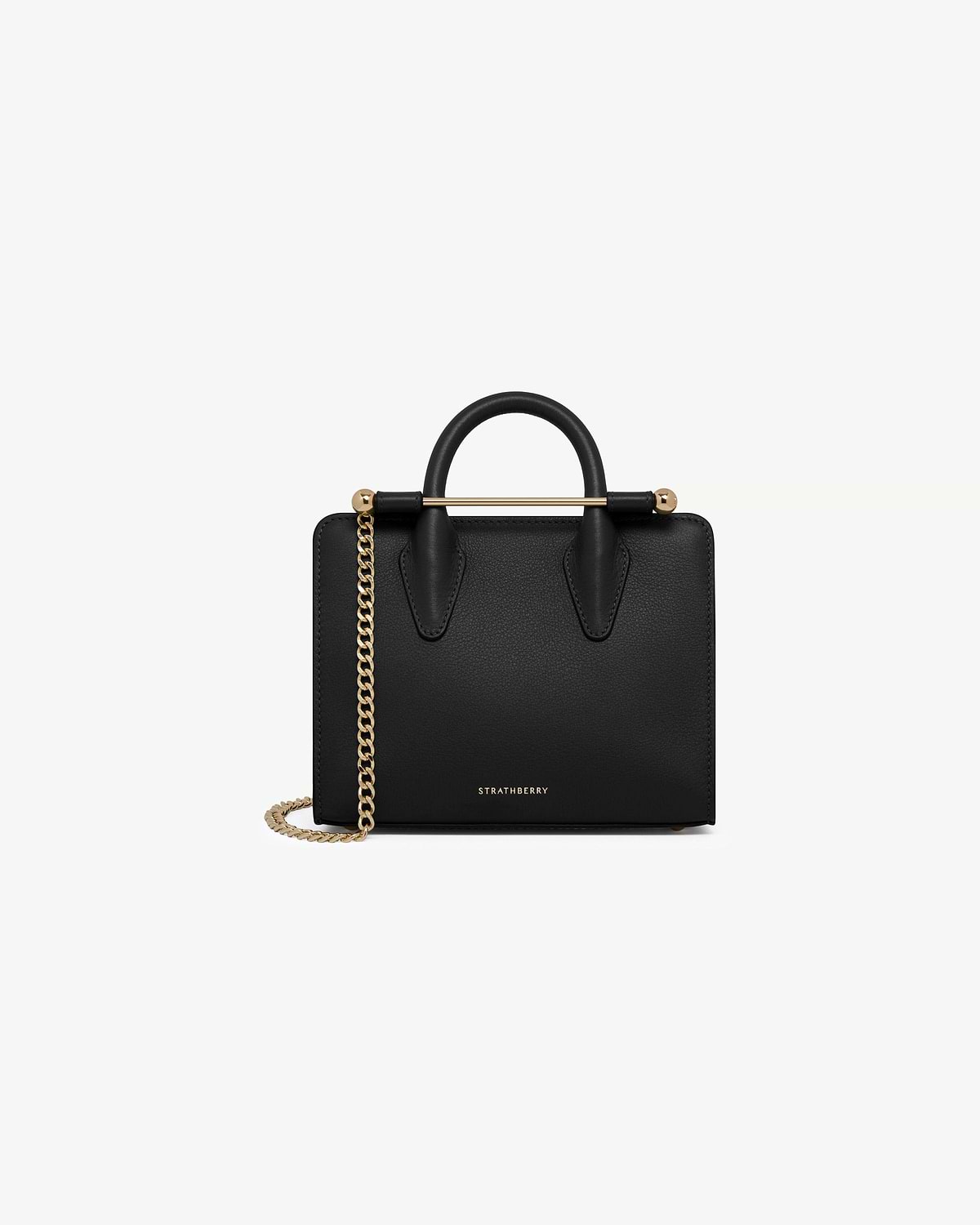 Strathberry black nano tote with top handles and gold chain strap.