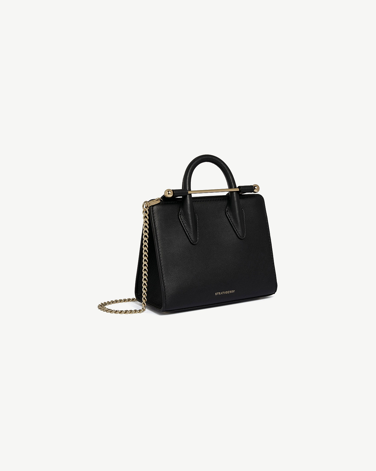 Black Strathberry Nano Tote with top handles, gold bar and chain strap.