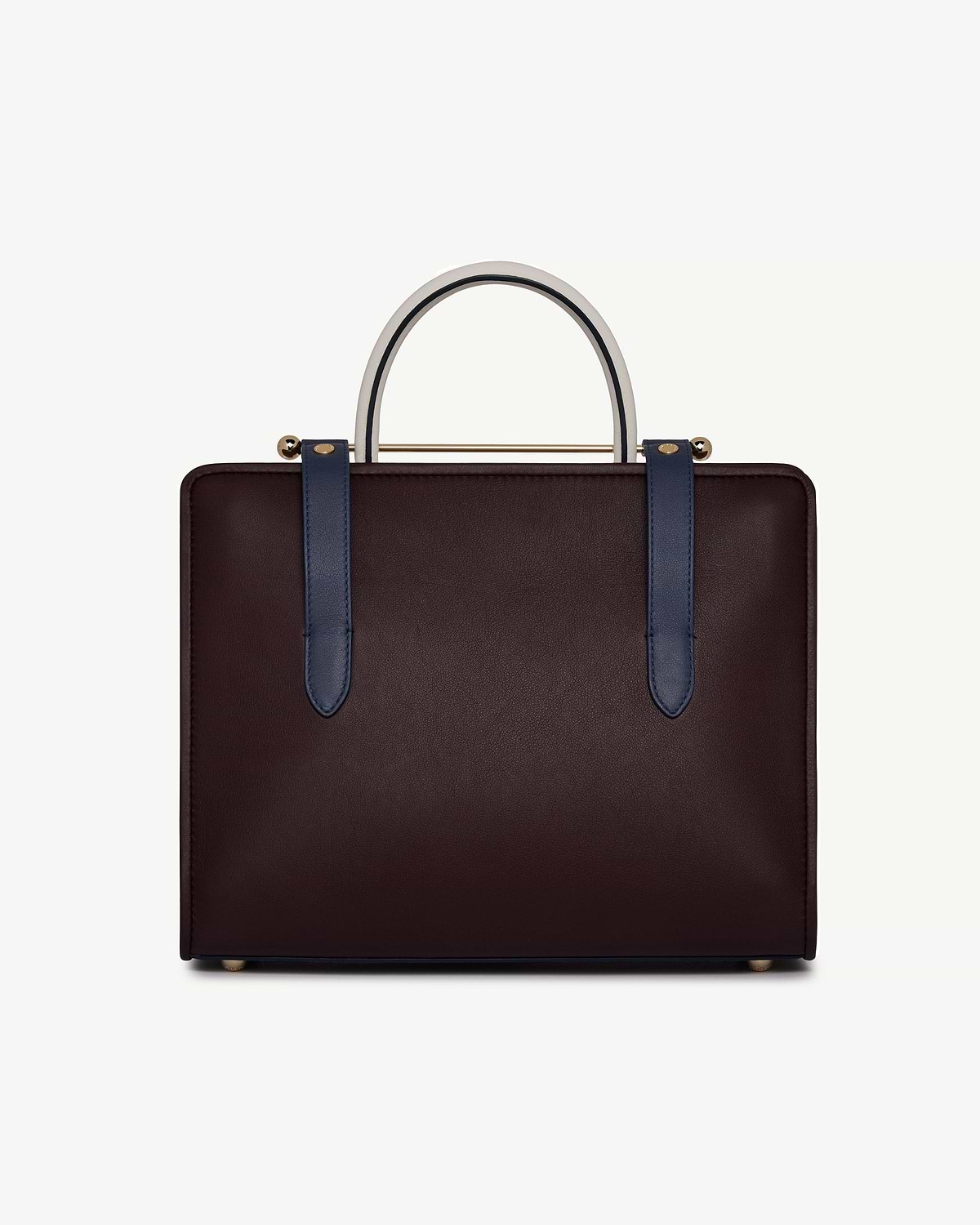 Burgundy leather midi tote with navy straps and vanilla top handle.