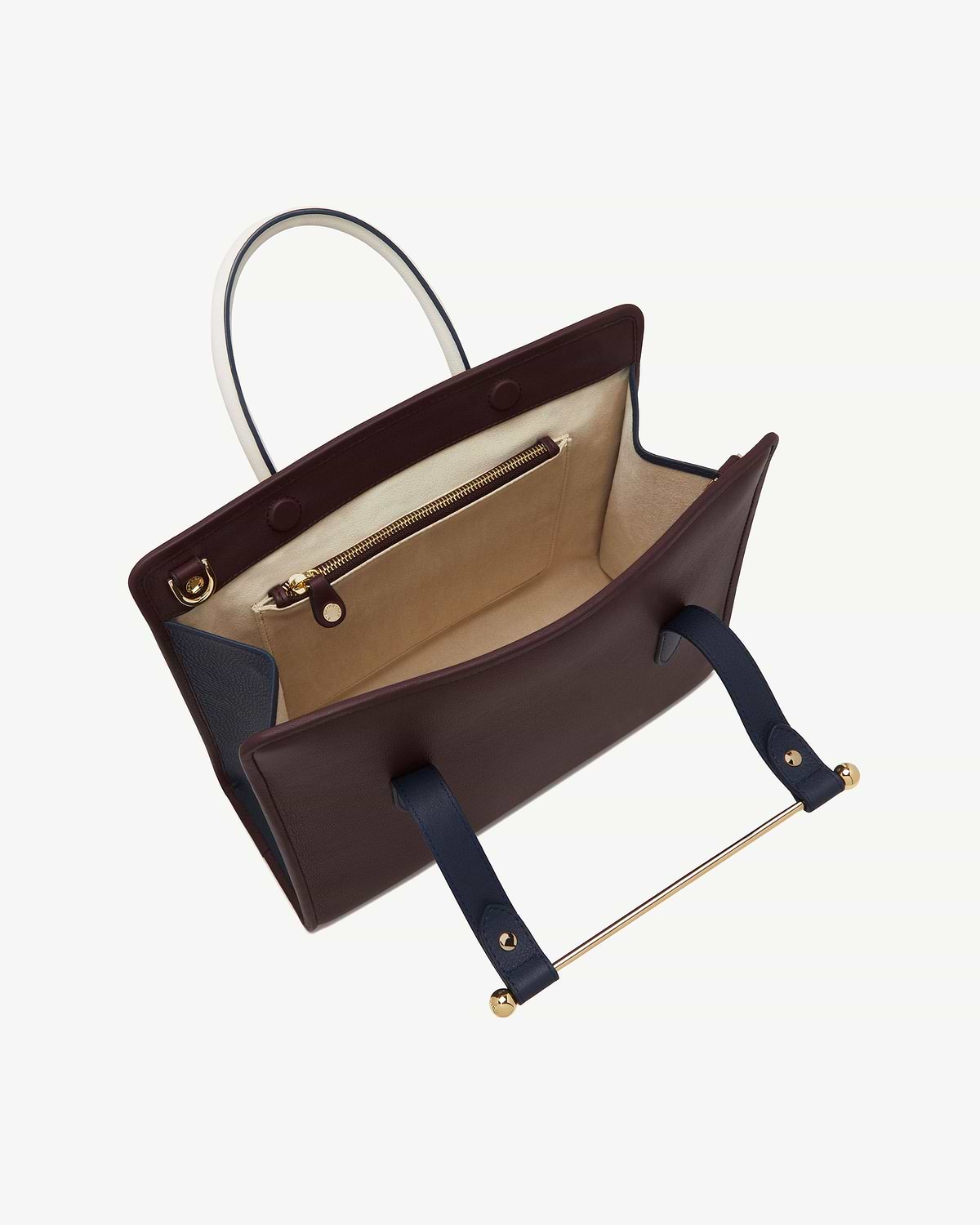 Burgundy, navy and vanilla midi tote open, showing interior pocket and gold hardware