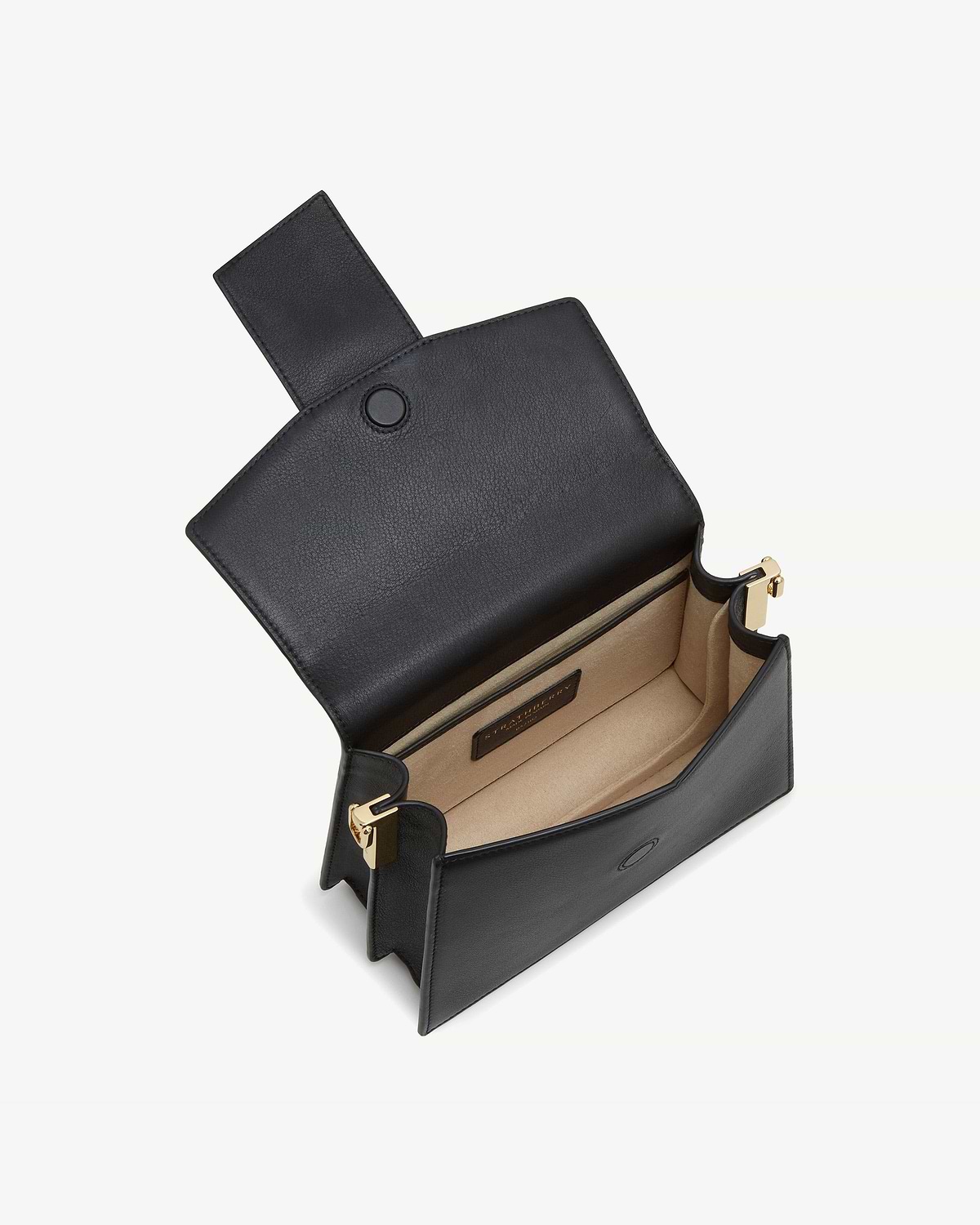 Black Box Crescent bag with flap open, beige interior and gold hardware.