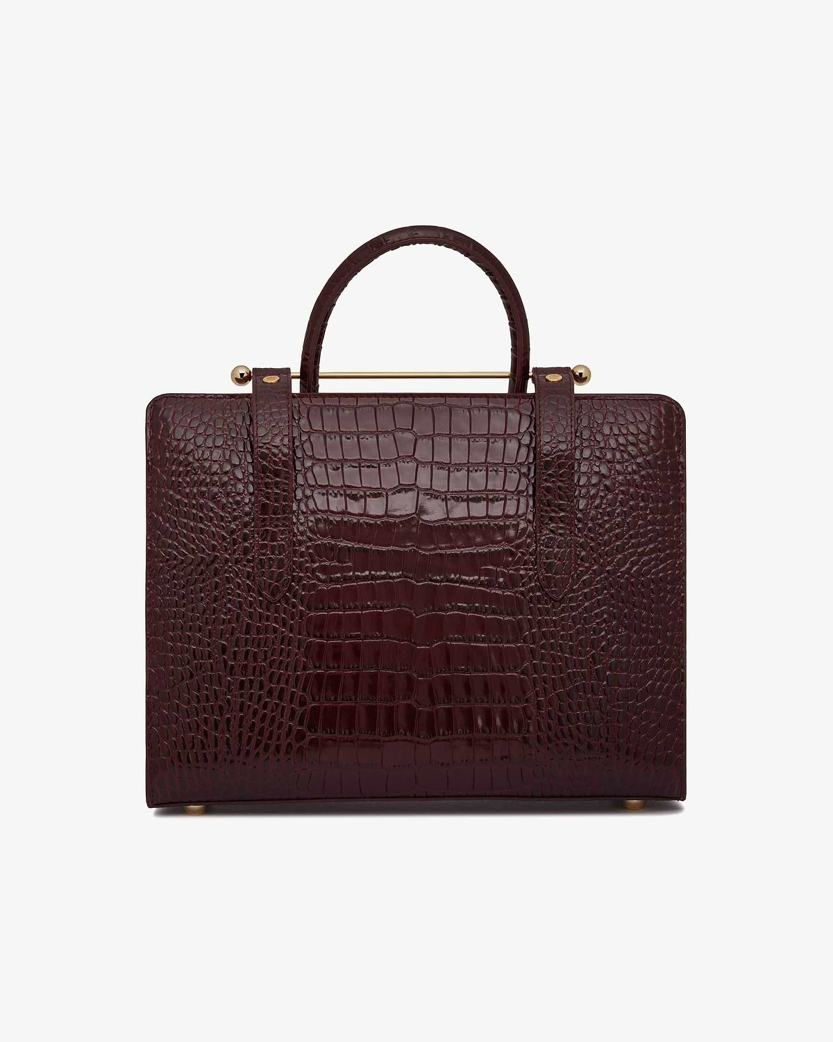 Burgundy croc-embossed midi tote with top handle and gold bar detail.
