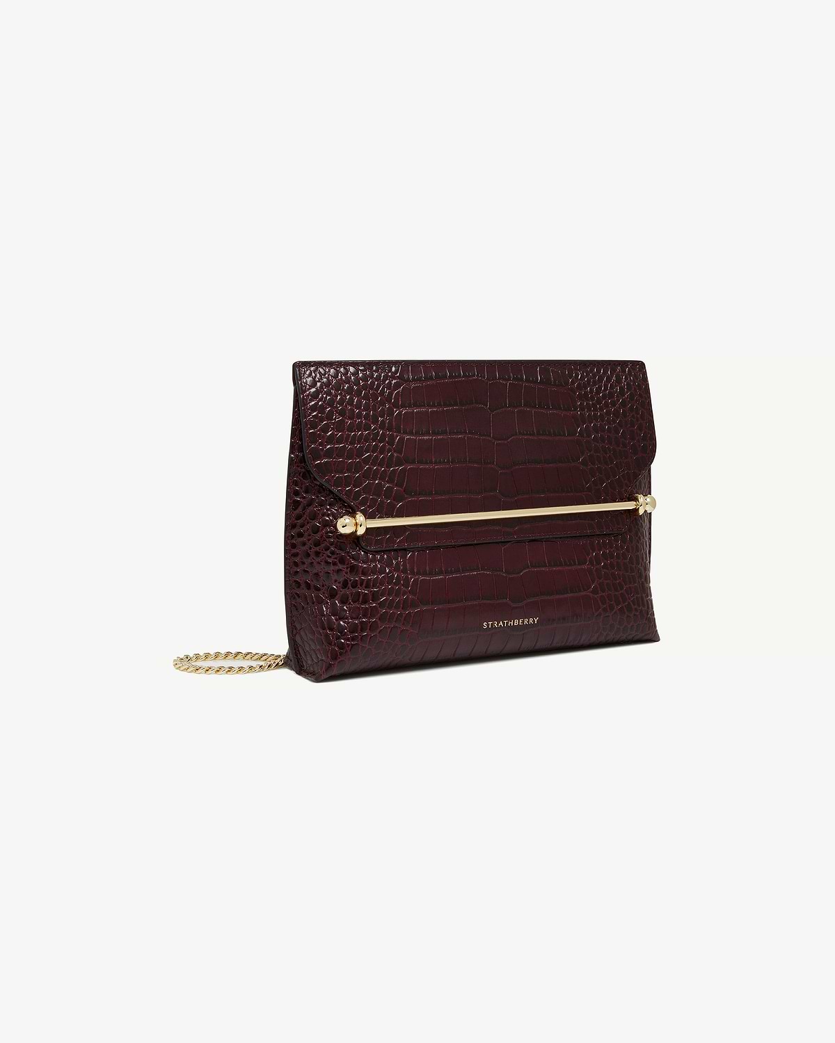 Burgundy croc-embossed Stylist bag with gold bar and chain, Strathberry logo.
