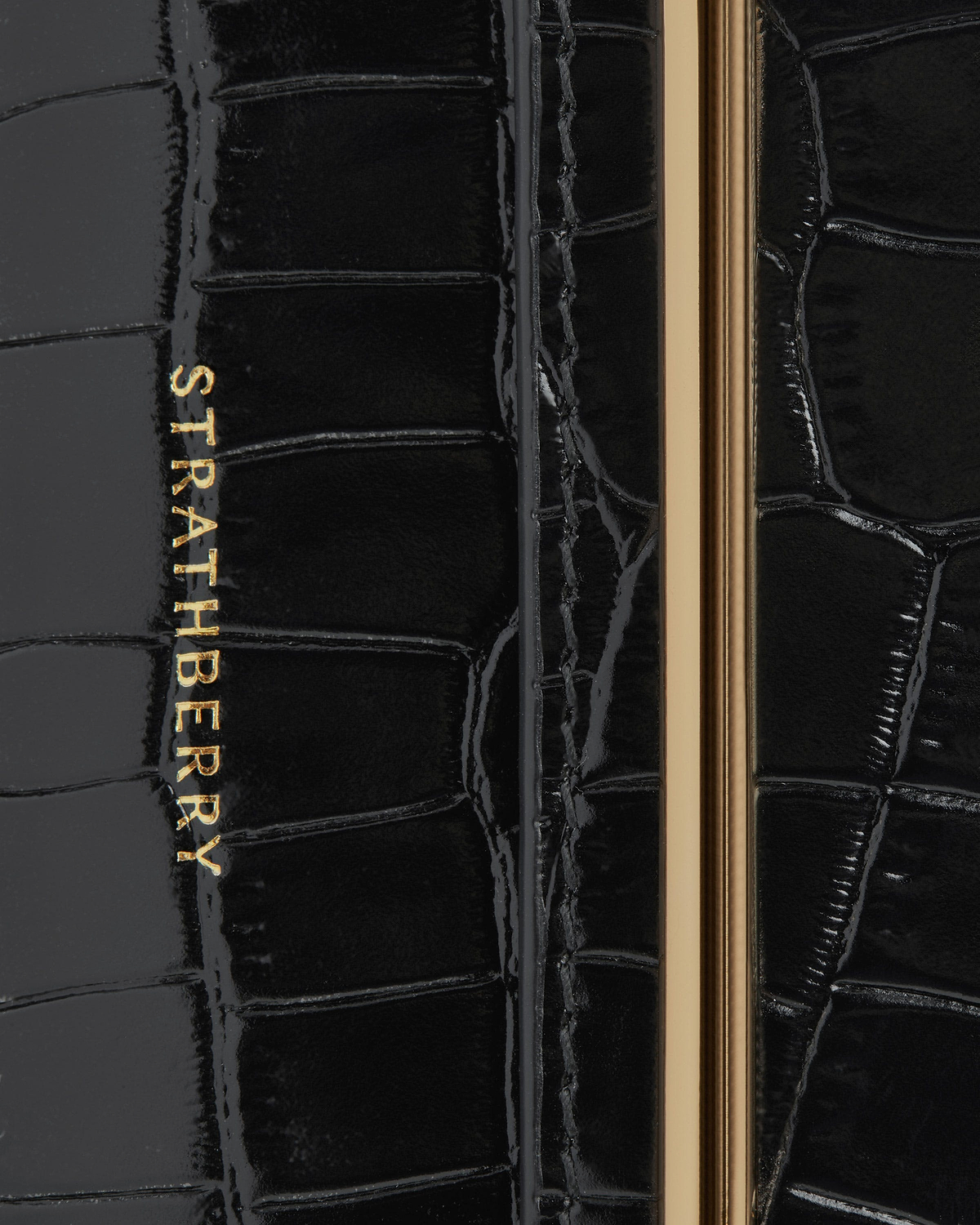 Strathberry Multrees chain wallet in black croc leather with gold hardware and logo