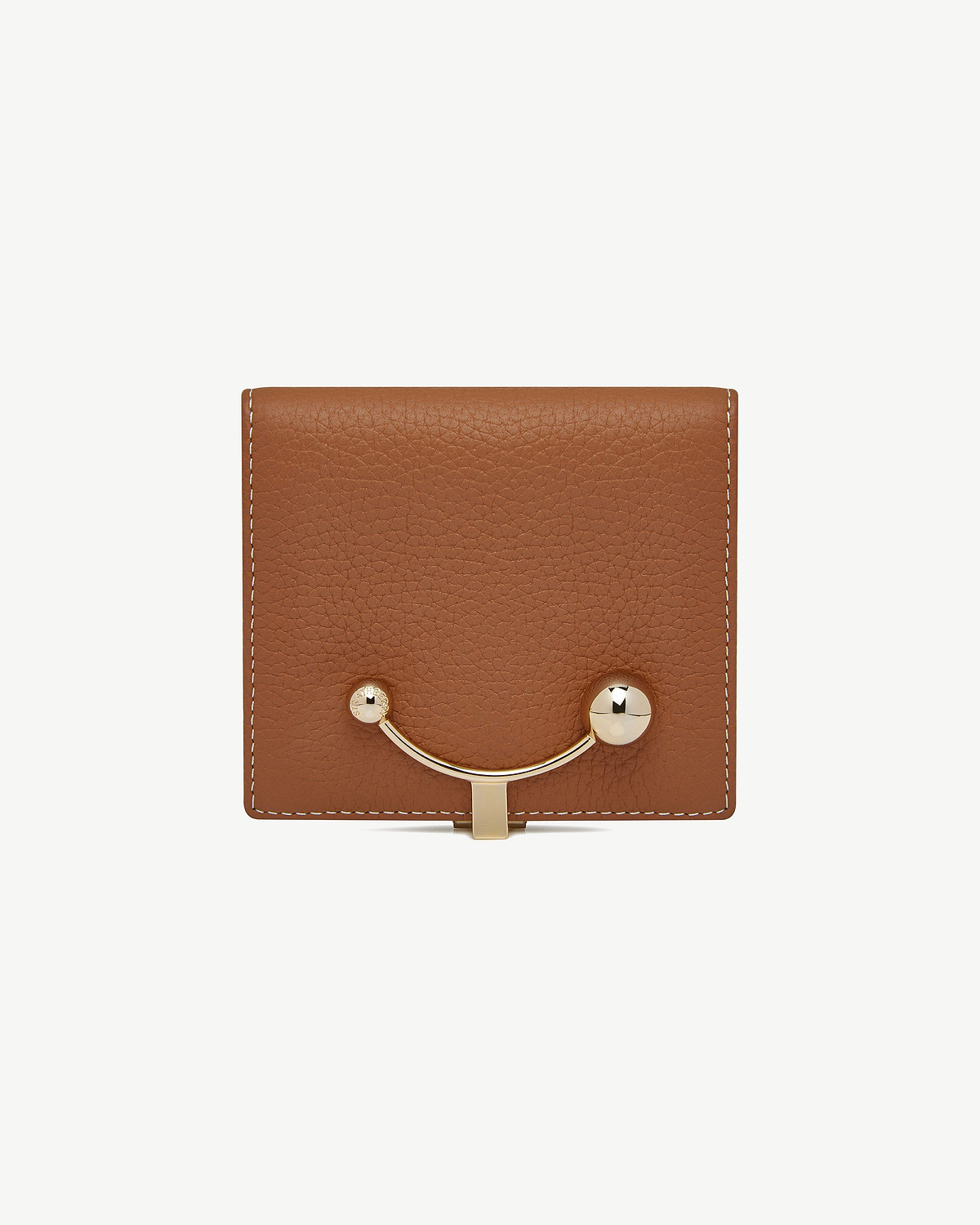 Tan leather wallet with vanilla stitching and gold crescent-shaped clasp