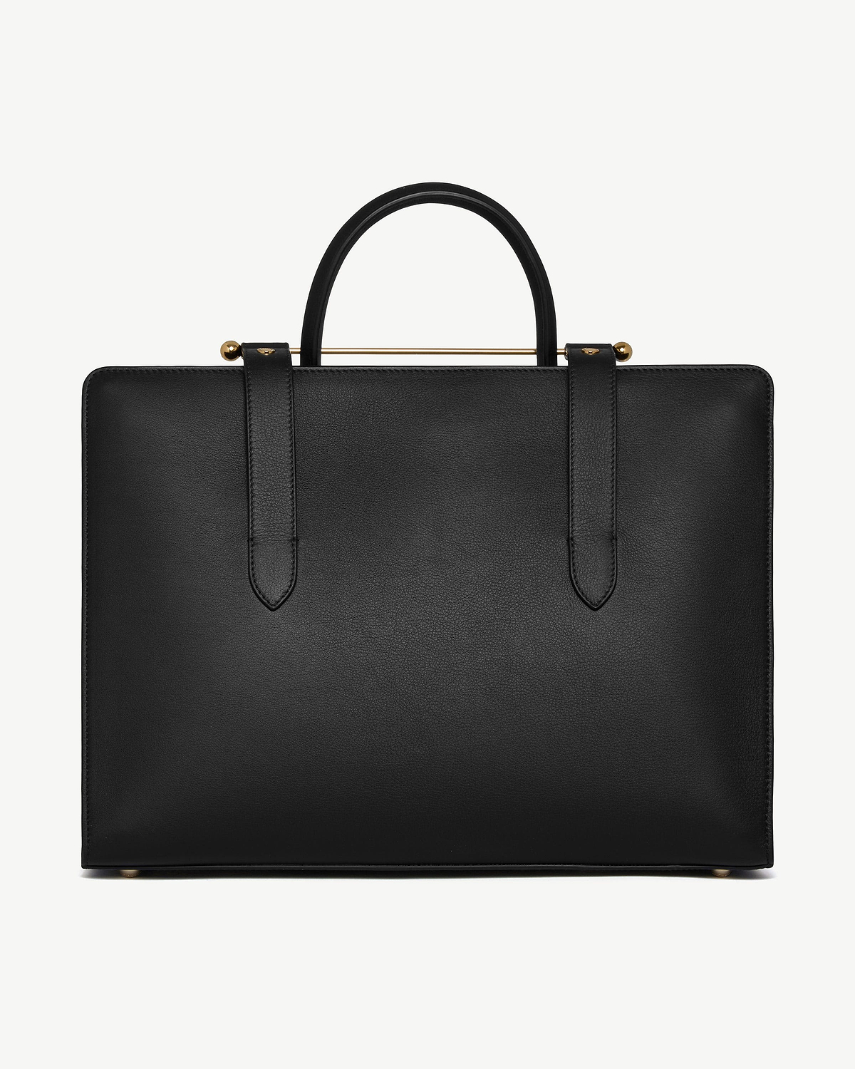 Black structured tote with top handles, gold bar detail and metal feet.