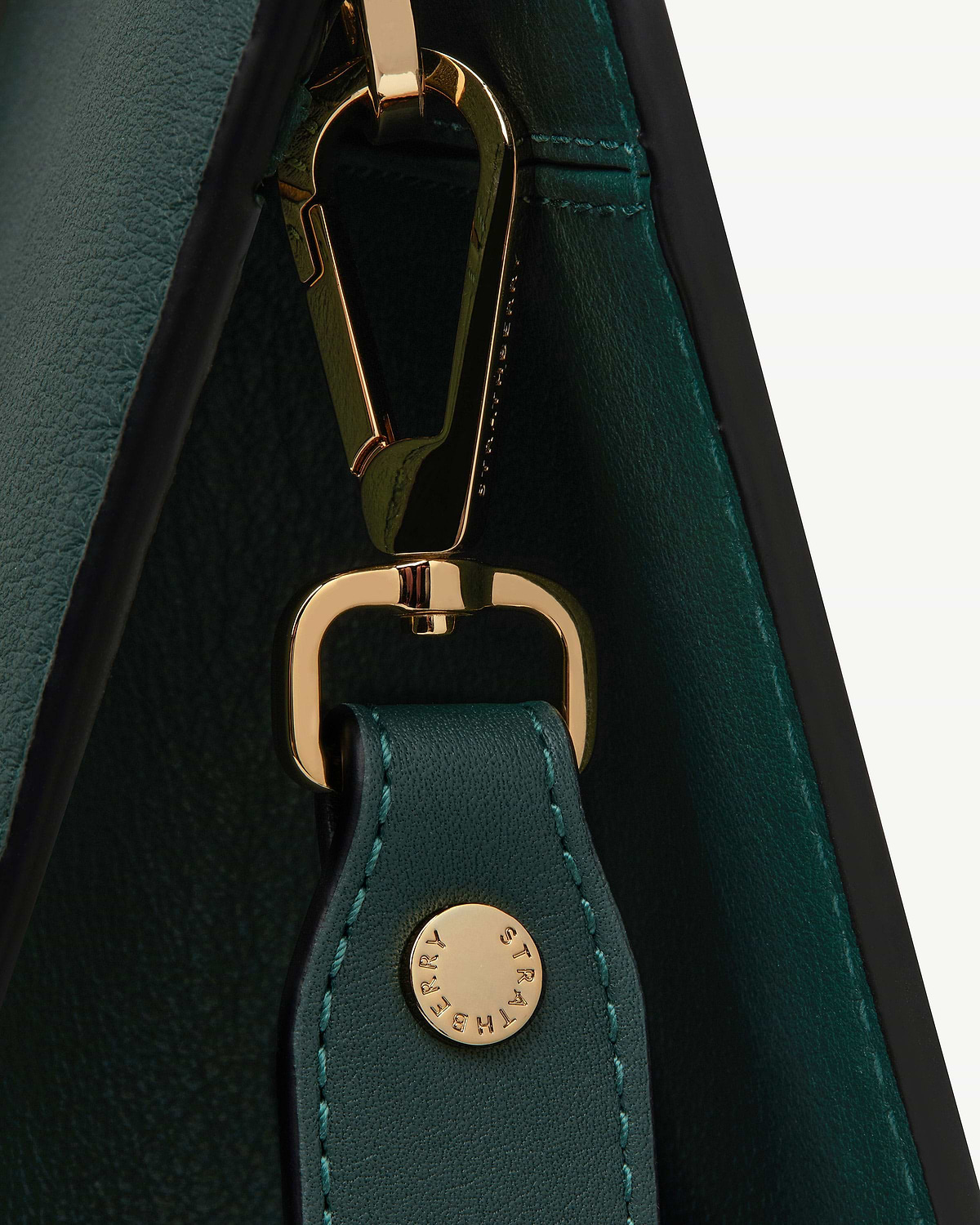 Bottle green leather tote strap with gold clasp and Strathberry stud