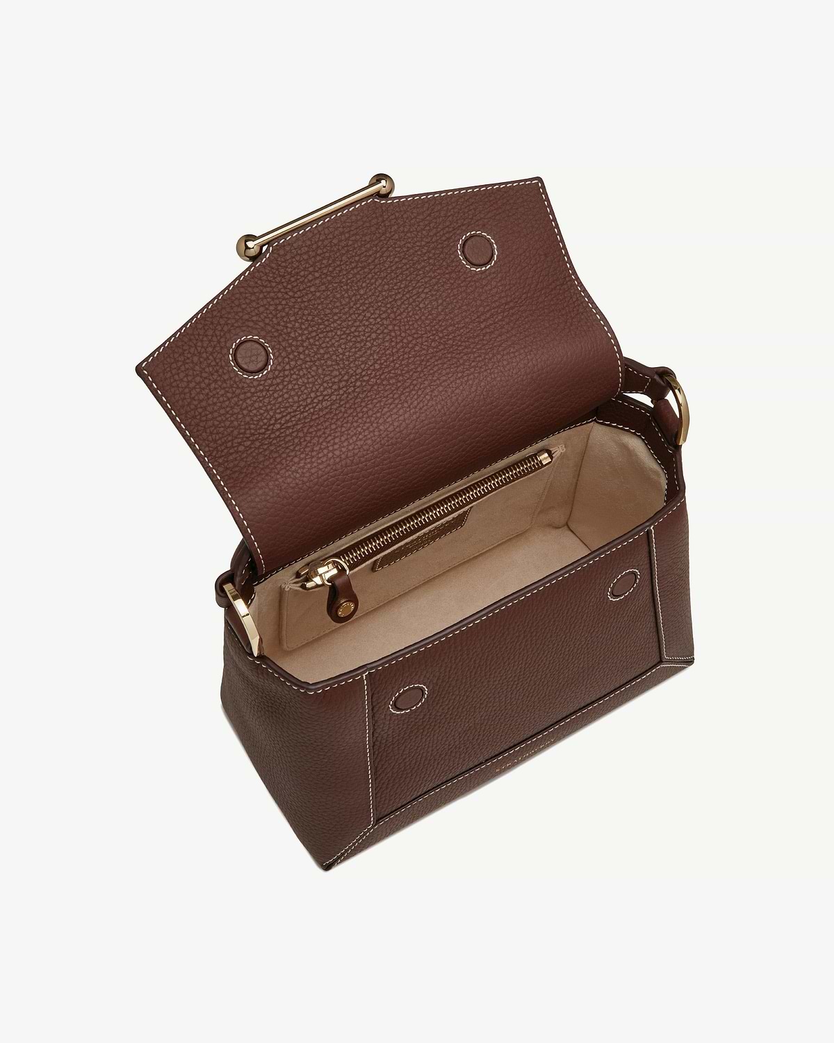 Chocolate leather bag with vanilla stitching, open to show beige interior and zip pocket.