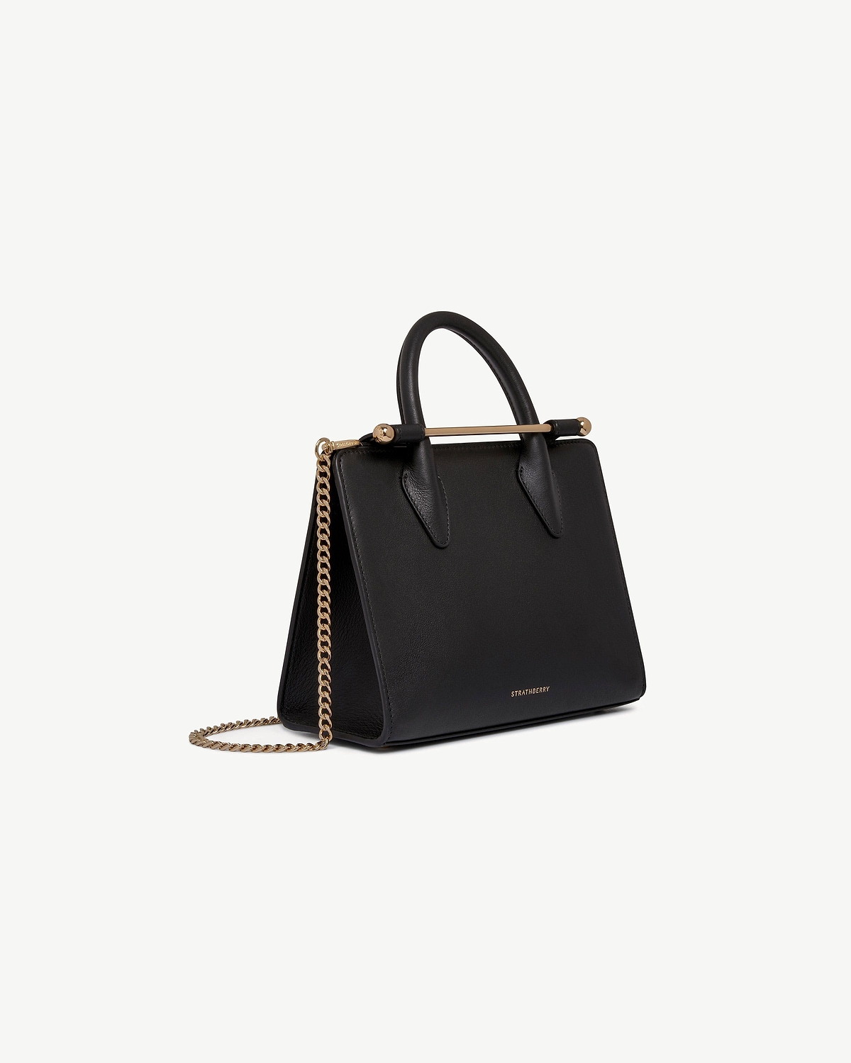 Black Strathberry mini tote with top handles and gold chain shoulder strap.