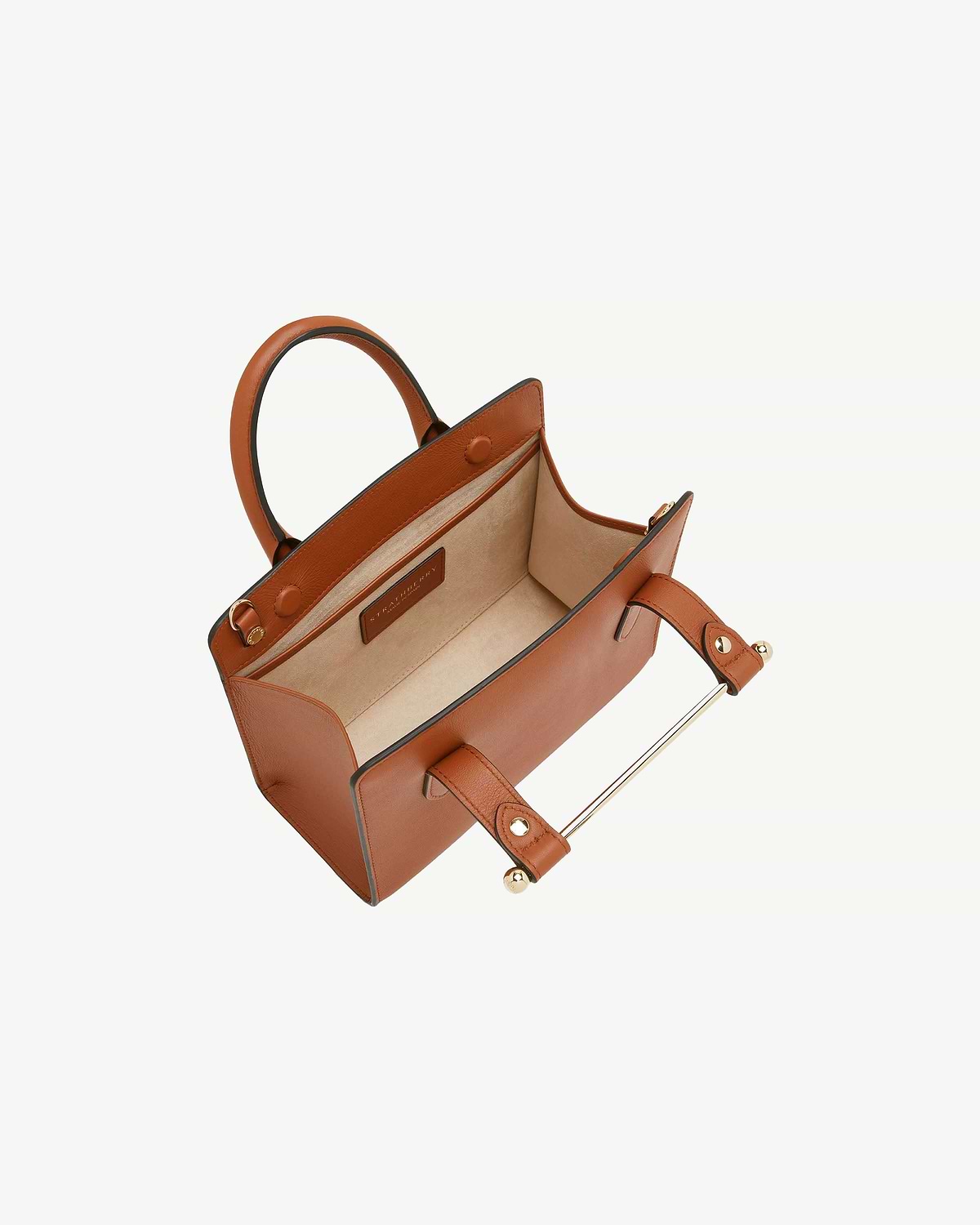 Chestnut mini tote with top handles, open interior and visible brand label