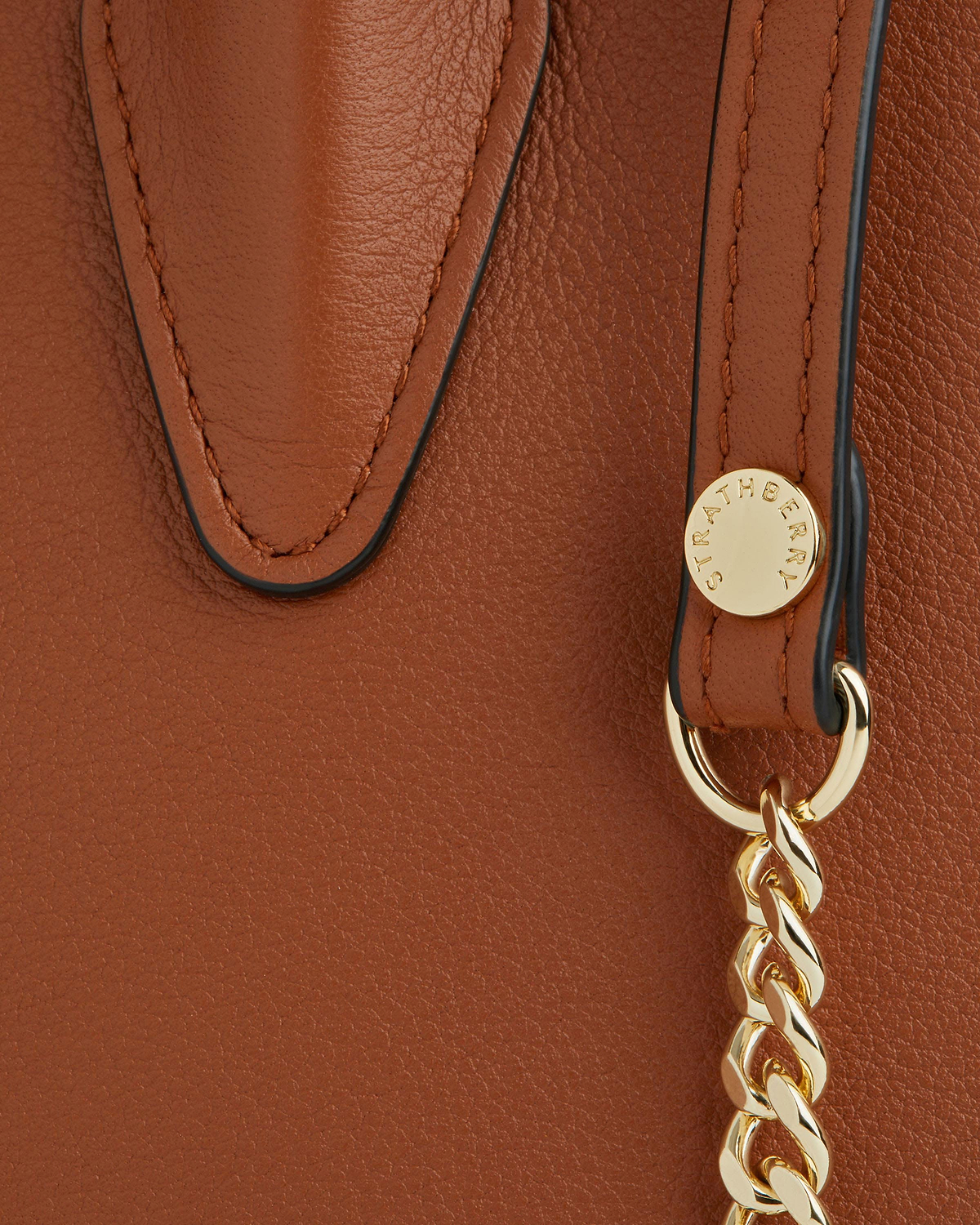 Chestnut mini tote leather detail with gold Strathberry stud and chain.