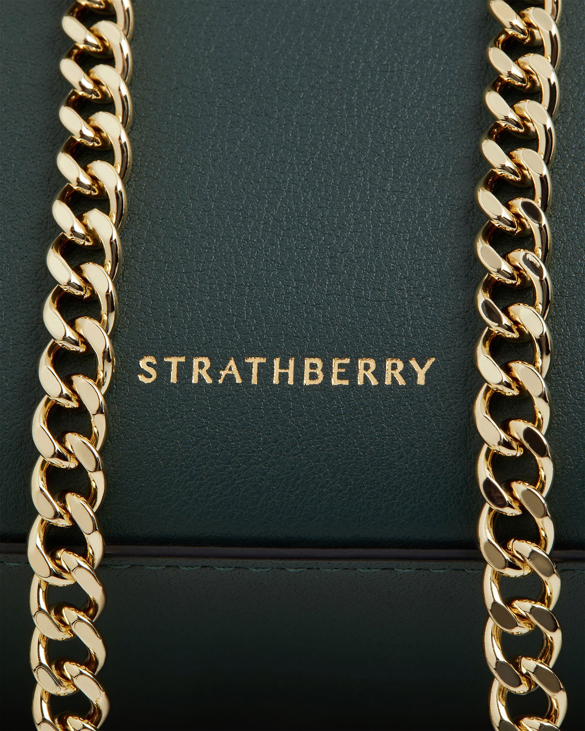 Strathberry bottle green mini tote with two gold chain straps and logo