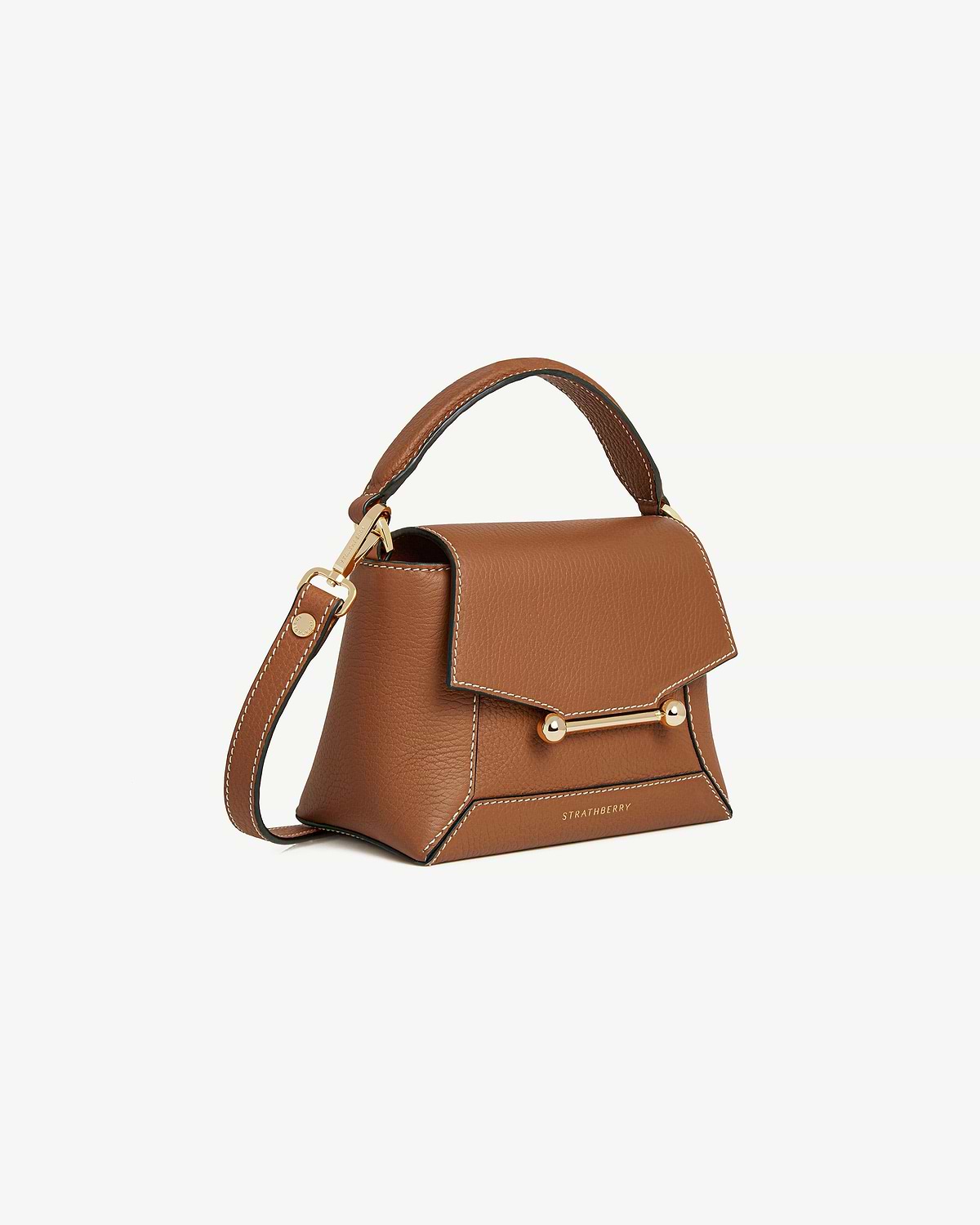 Tan leather Strathberry Mosaic Nano bag with vanilla-coloured stitching, gold bar closure and top handle.