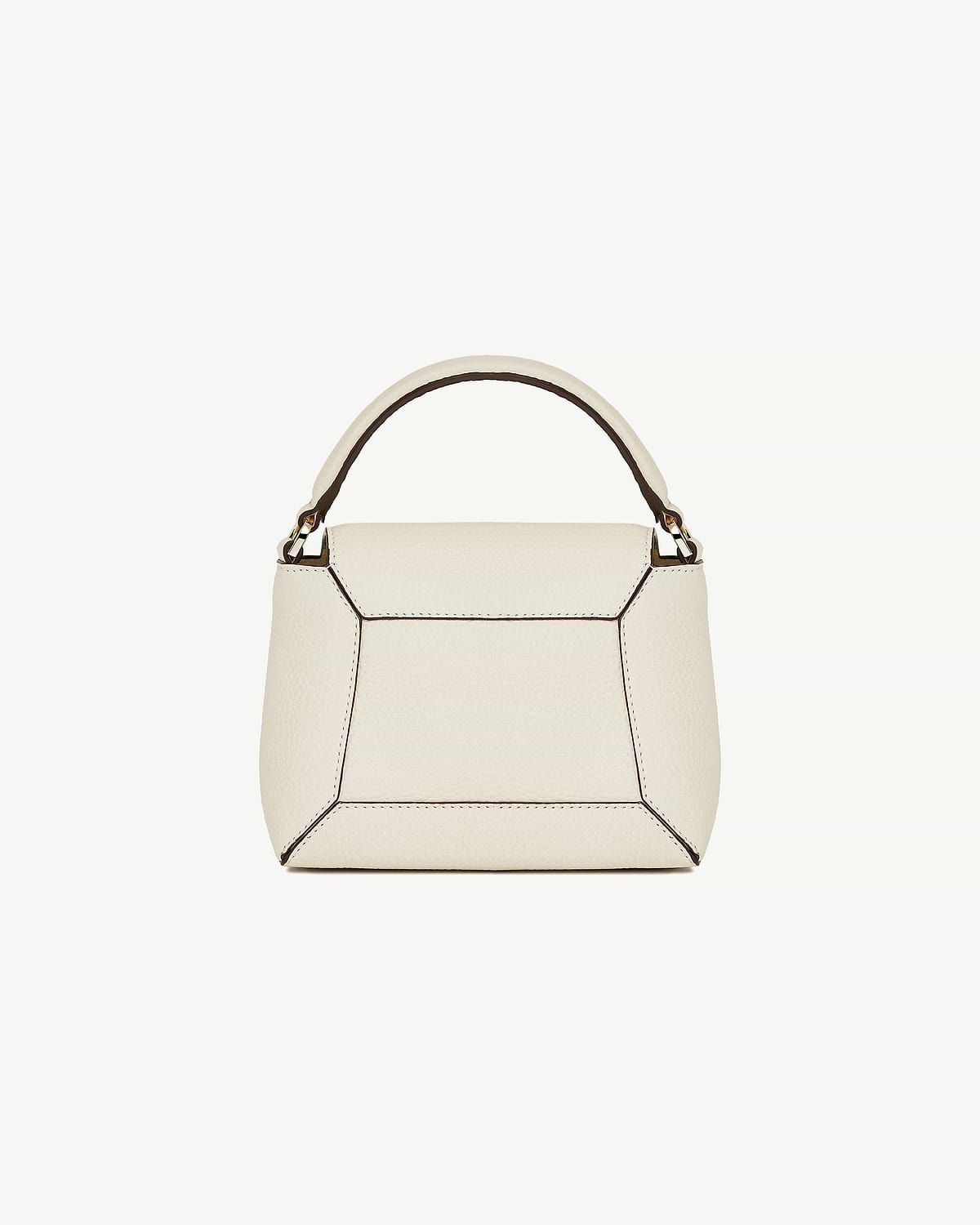 Vanilla leather top-handle bag with geometric panelling, contrast piping and gold hardware.