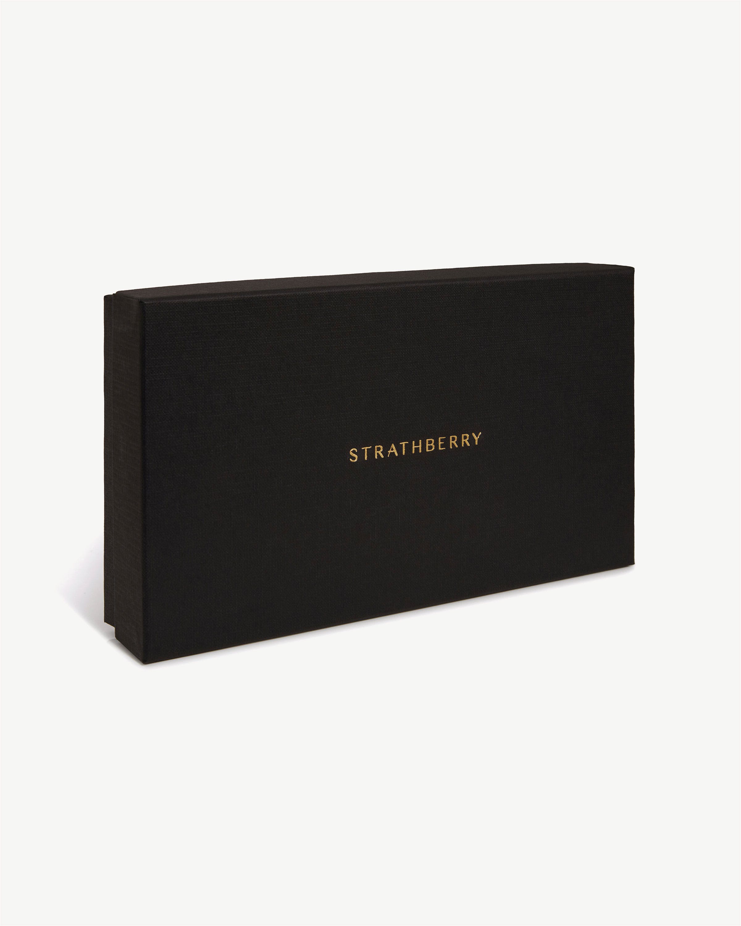 Black rectangular Strathberry box with gold logo, angled on white background.