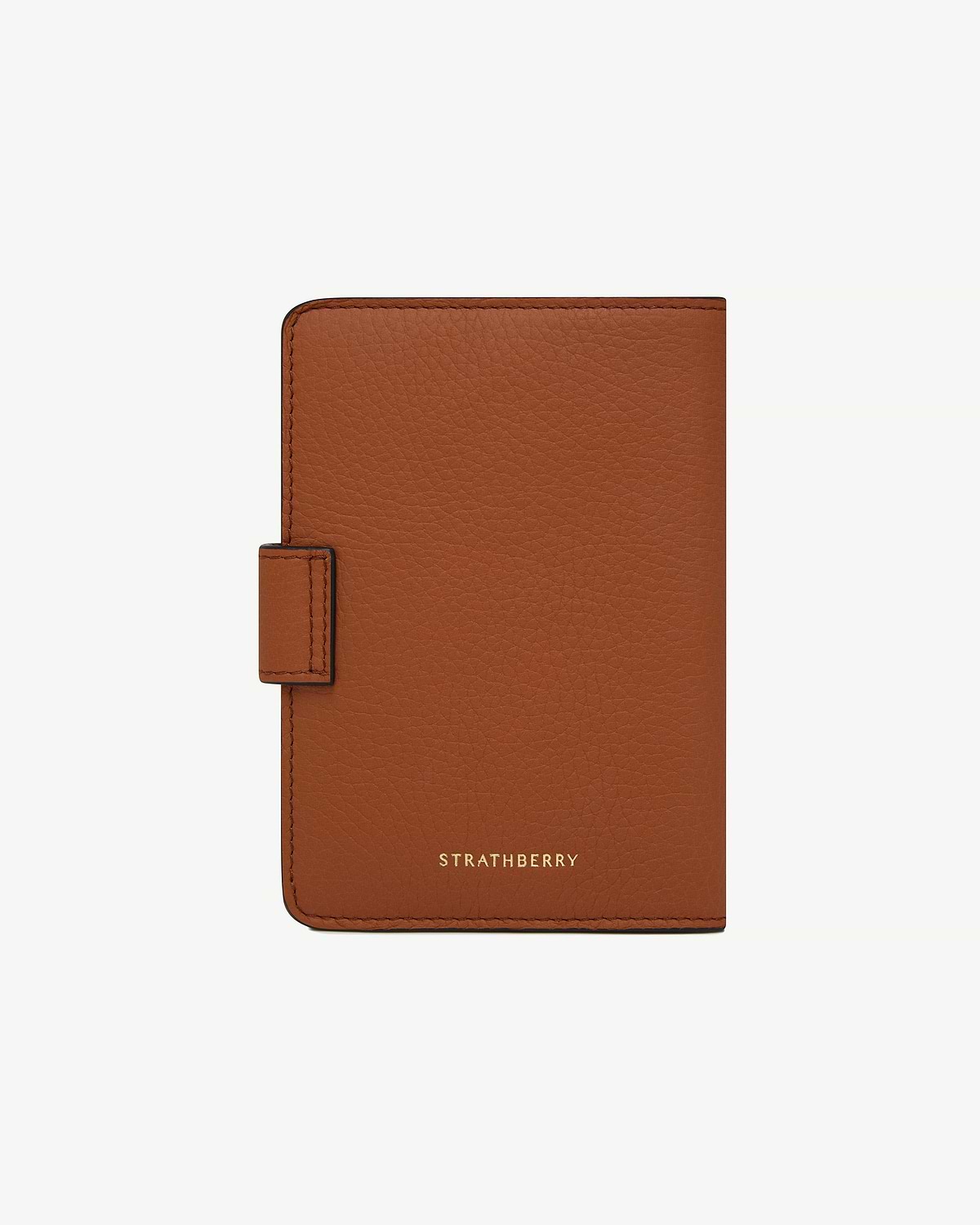 Strathberry tan passport holder in pebbled leather with tab closure